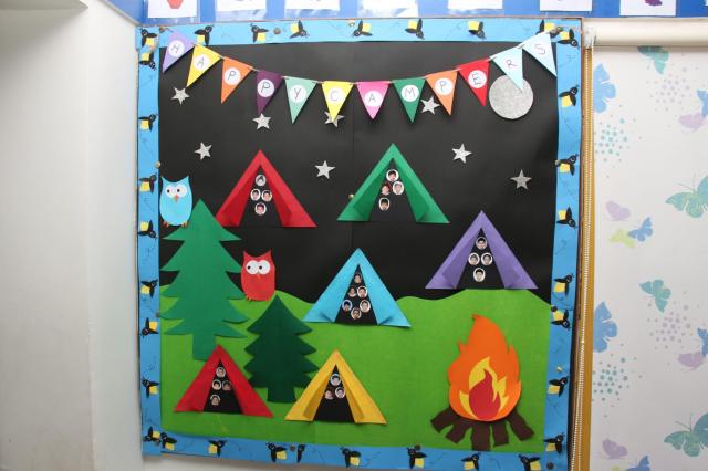 Vibrant Classroom Ambiance: Colorful Camping Tents and Bonfire Decor by CHIREC Teachers for PP1A Simbas