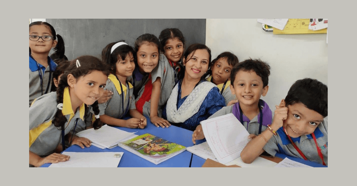 Happy CHIREC teacher and students in classroom